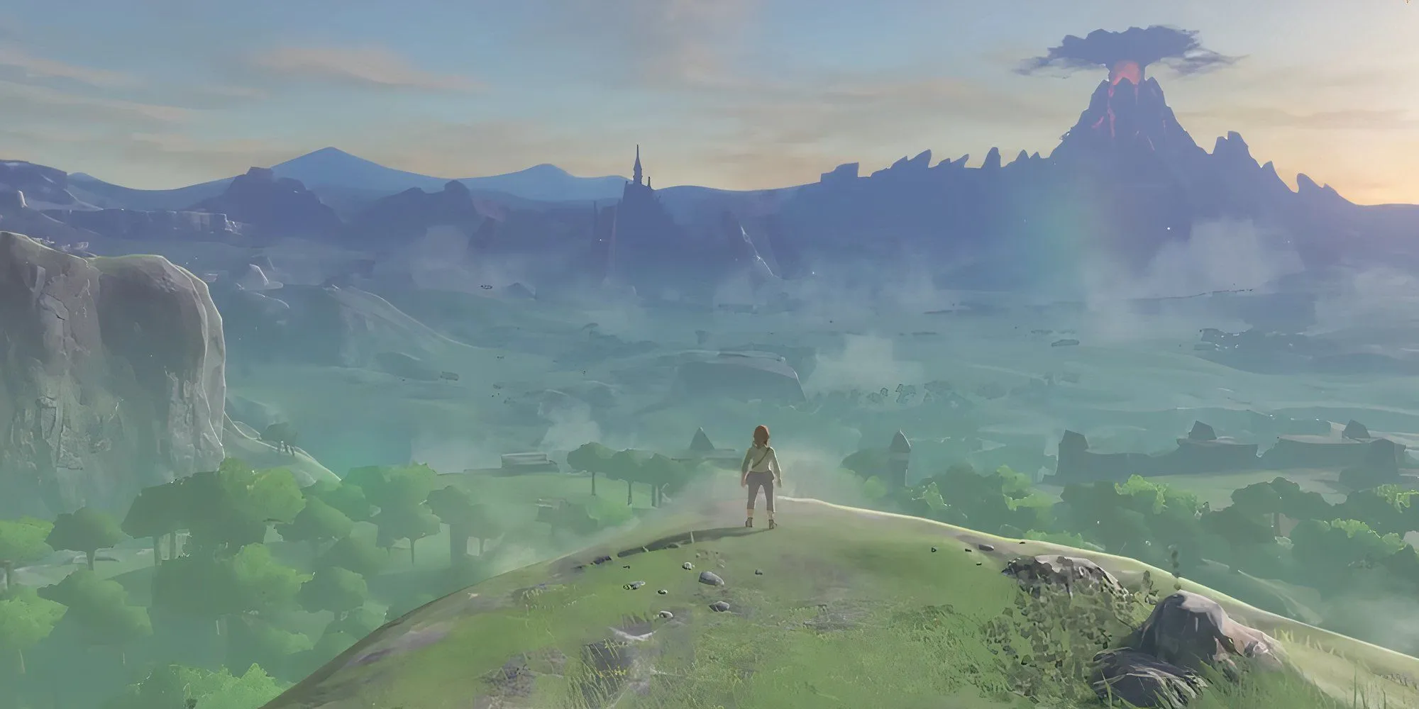 Nhân vật Link trong The Legend of Zelda: Breath of the Wild đứng trên vách đá, quay lưng về phía người xem.