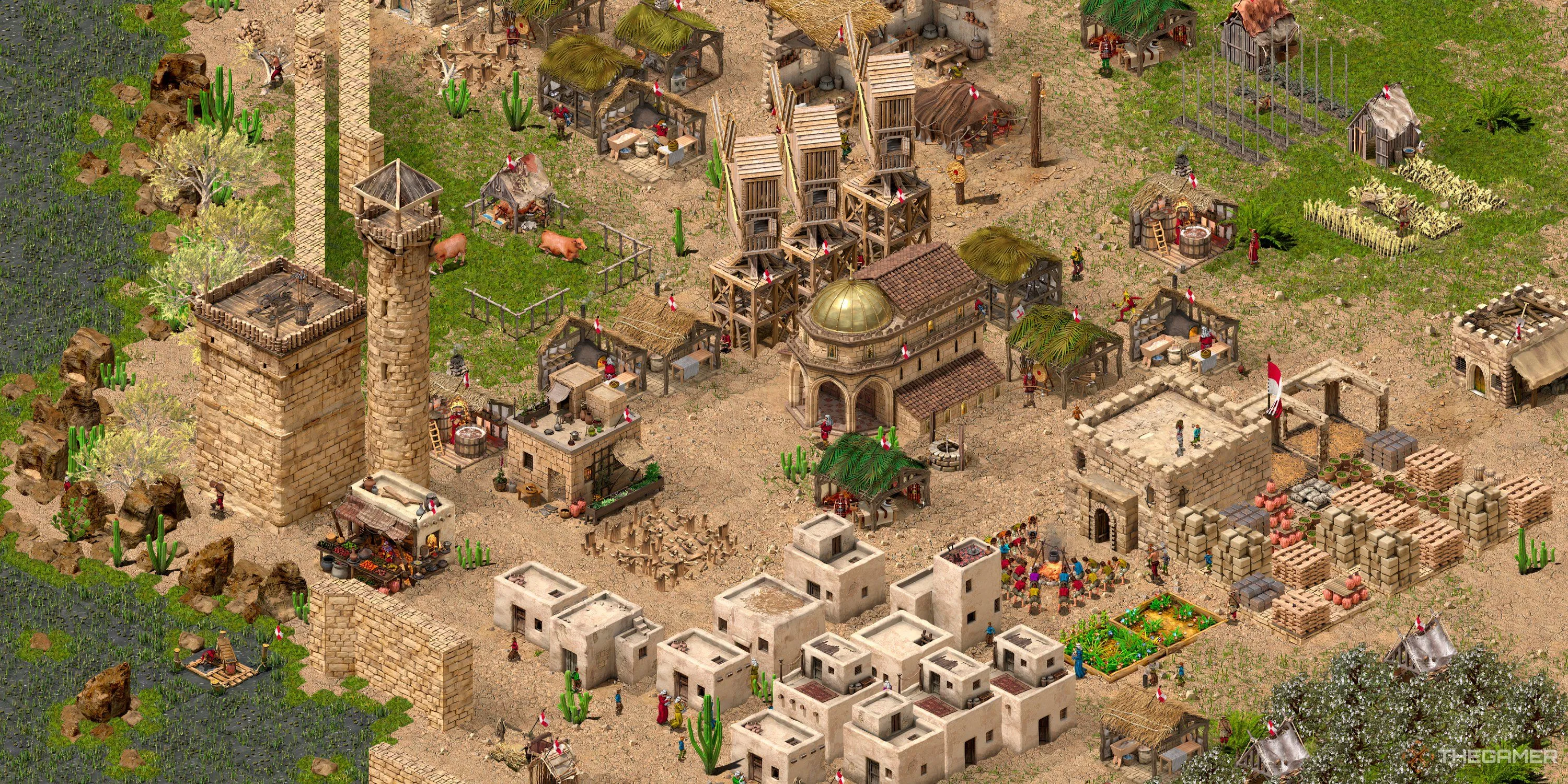 Một khu định cư với hệ thống phòng thủ cơ bản trong Stronghold Crusader Definitive Edition, minh họa chiến lược xây dựng và bố trí quân của các Chúa Tể phòng thủ.